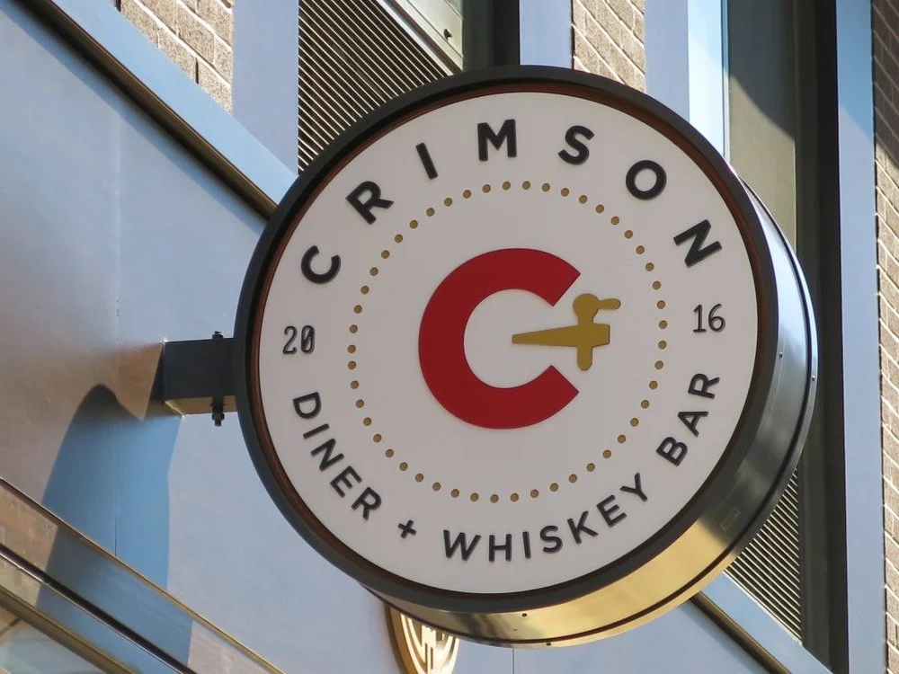 Crimson Logo Design Applied to exterior signage for the pod dc hotel . Signage by NeonFiveDesign.com.