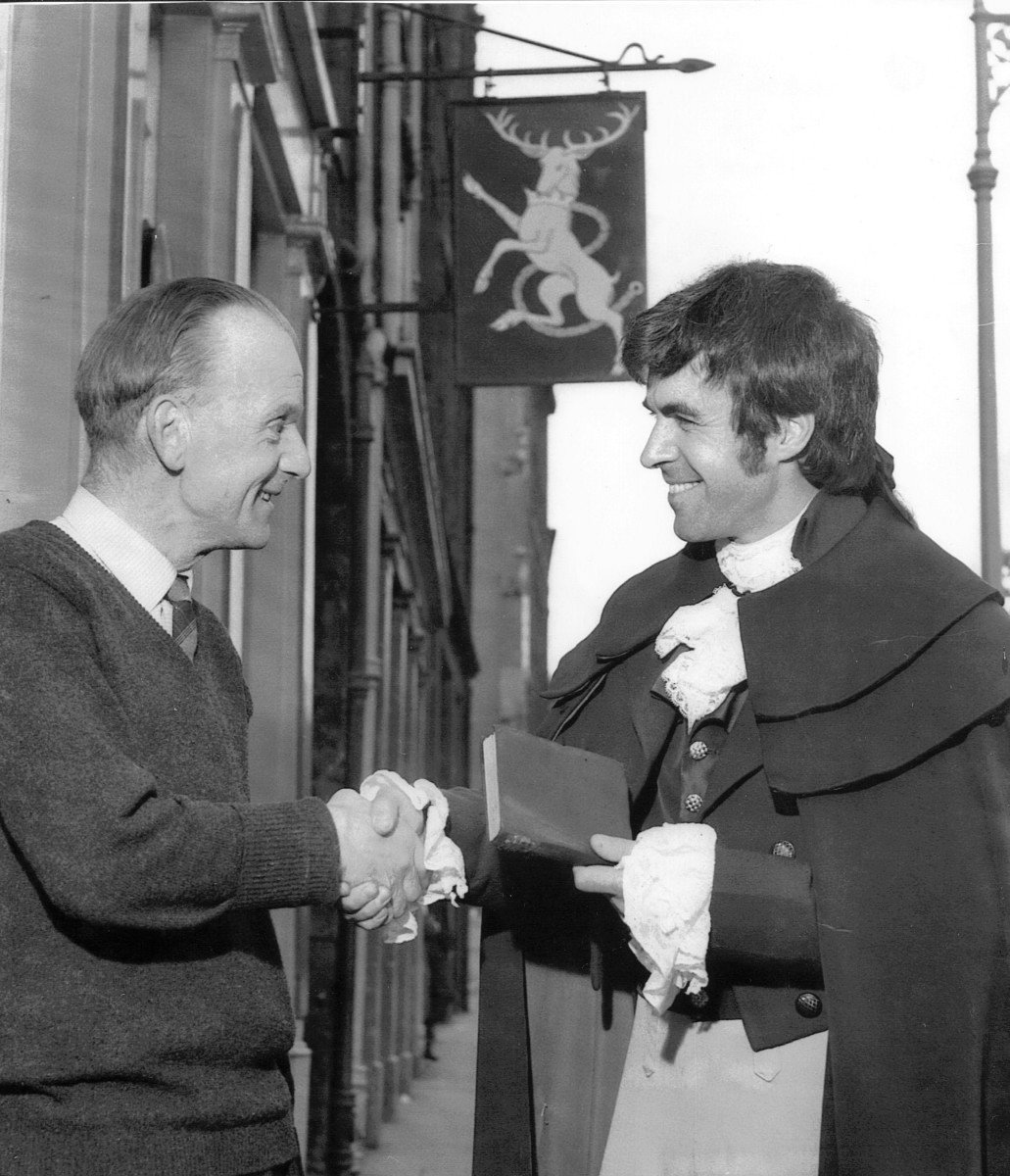 23_John Cairney as Robert Burns with Mr C. Littlejohn at the White Hart Inn 1965.jpg