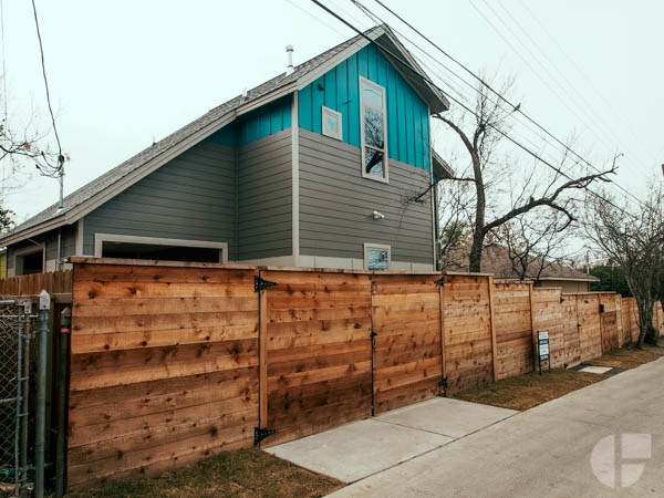  The house is in fact not a huge tower falling on top of you, but a nice two story with a wood fence. 