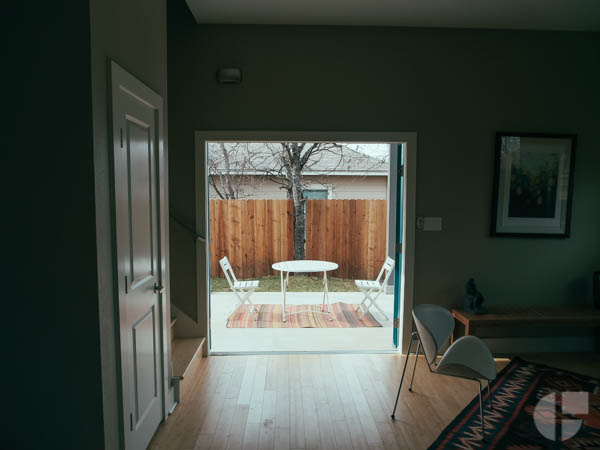 The entire first floor is public space. A simple kitchen / living room, a full bathroom, and french doors that open out to a covered patio. 