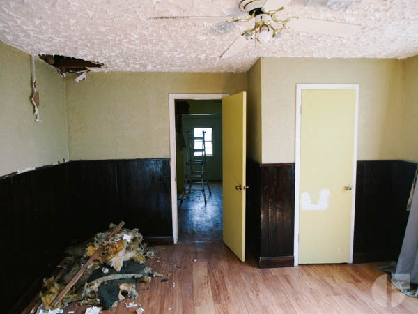Original yellow on beige on brown color scheme. This was the living/bedroom on one side of the house.