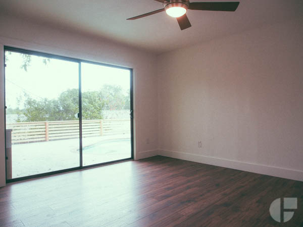 En suite bedroom with access to pool outside.