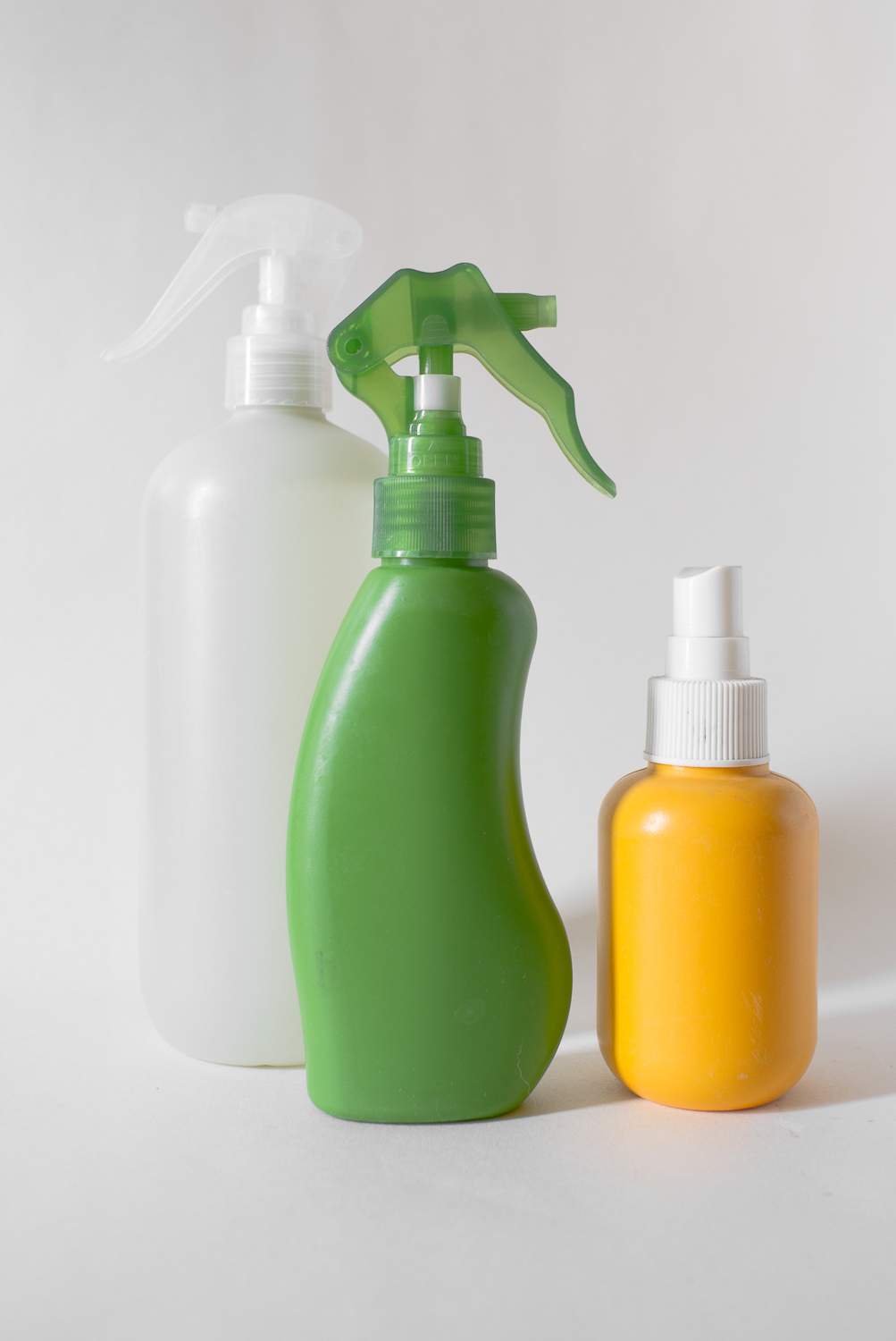 Three label-free sprayers that once held non-toxic substances for household or cosmetic use. (Depending on the adhesive used by the manufacturer, removing the label is sometimes a job for a heavy-duty solvent, such as lighter fluid.)