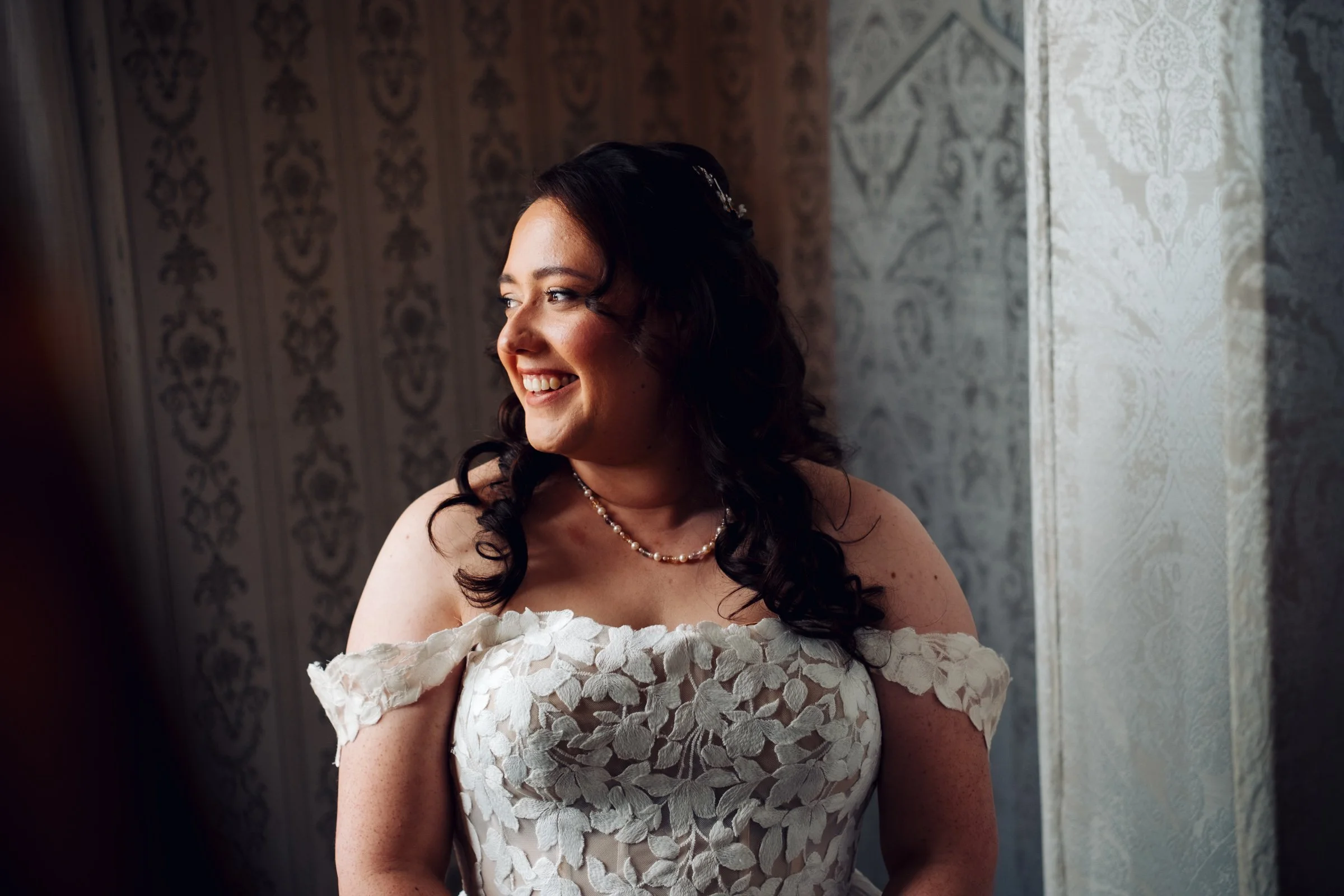 Bride in her dress before the ceremony at Grittleton House