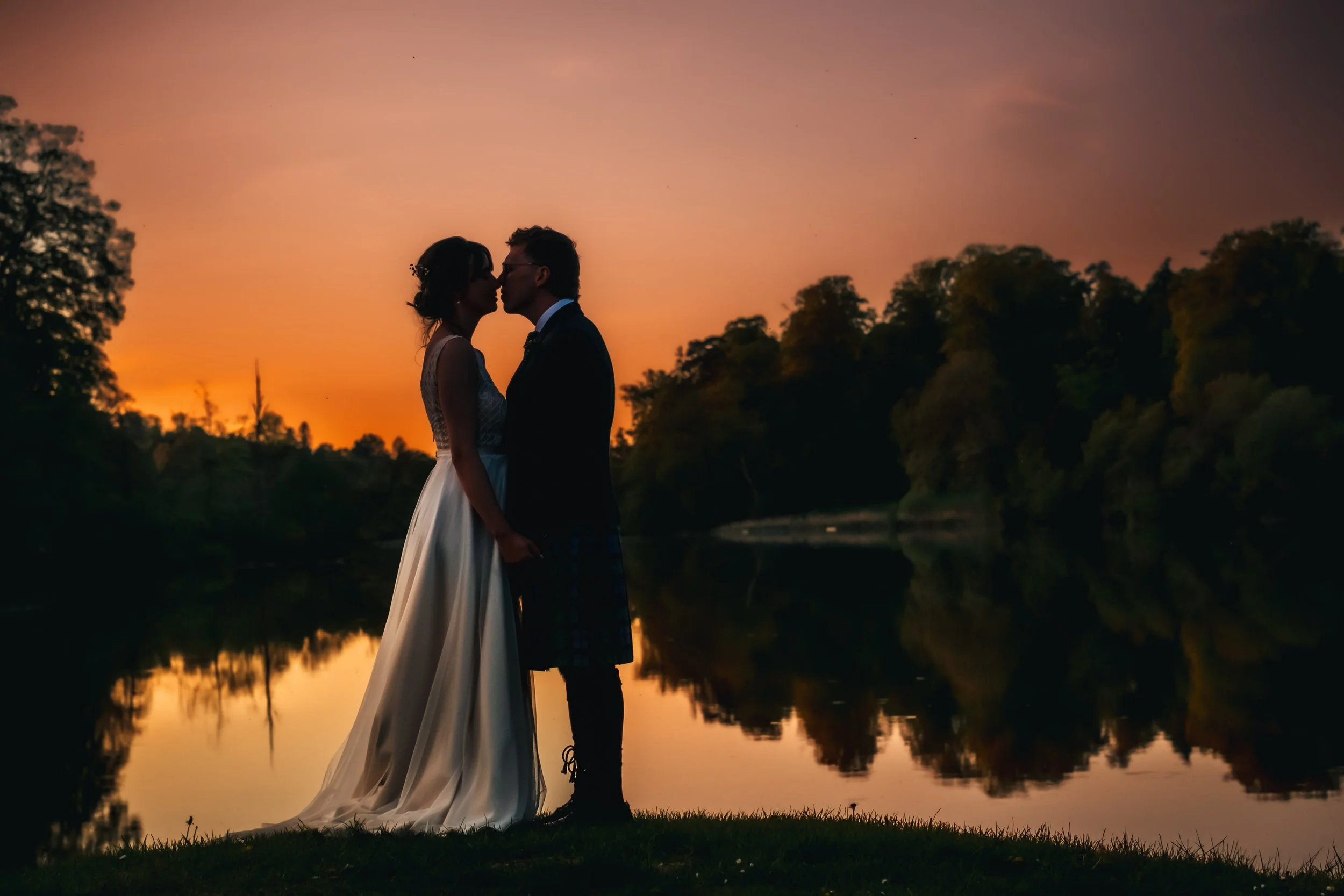 Bride and Groom by the lake at Ashley Wood Farm