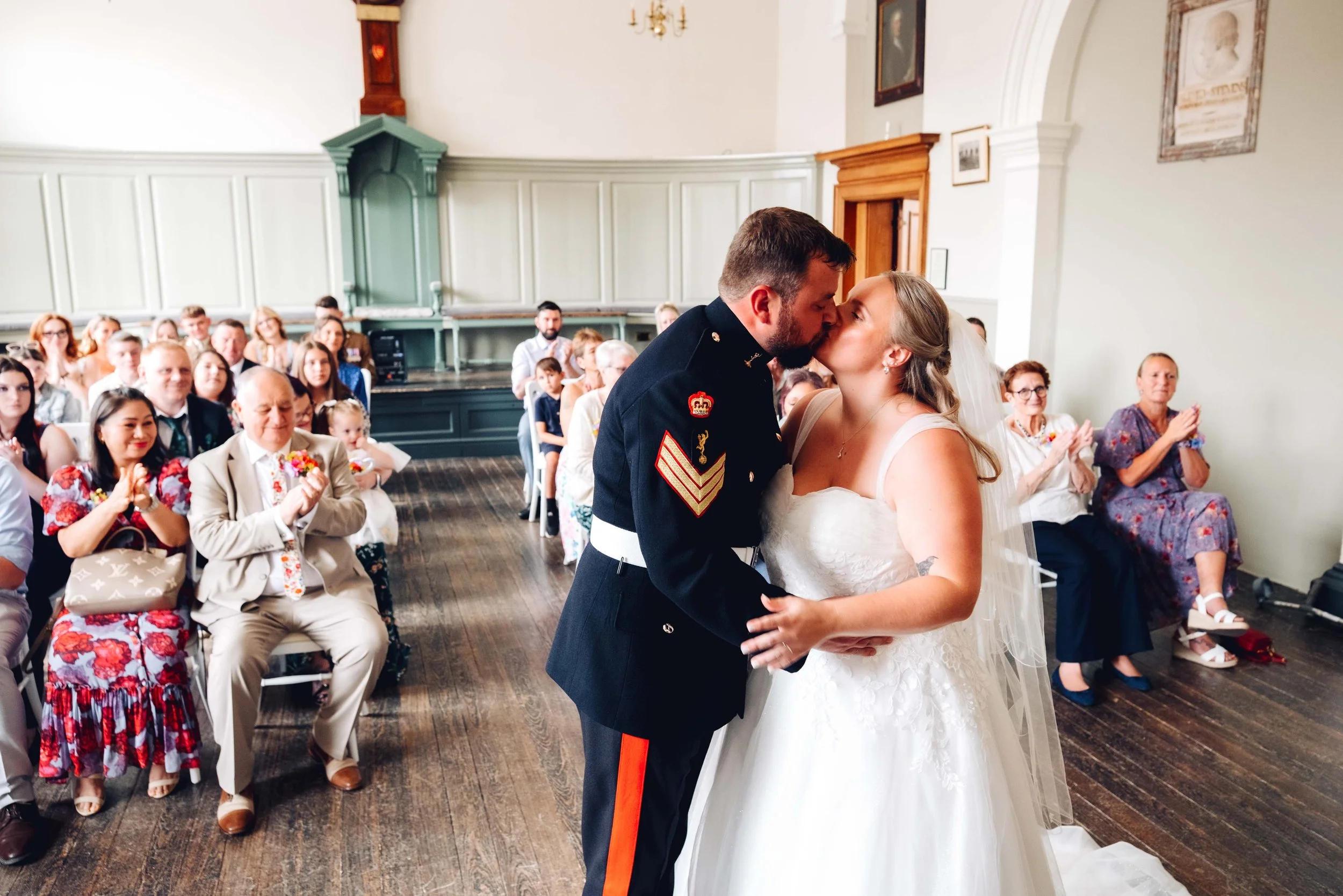 bride and groom share a kiss at Blandford Corn Exchange