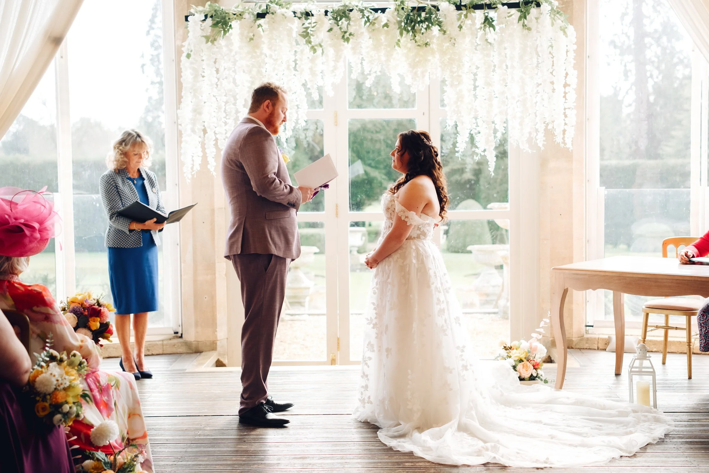 Issac reads his vows to Ellie at Grittleton House