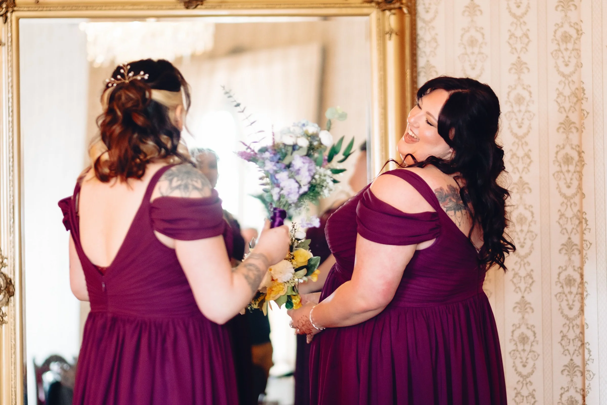 Bridesmaids getting ready at Grittleton House and laughing