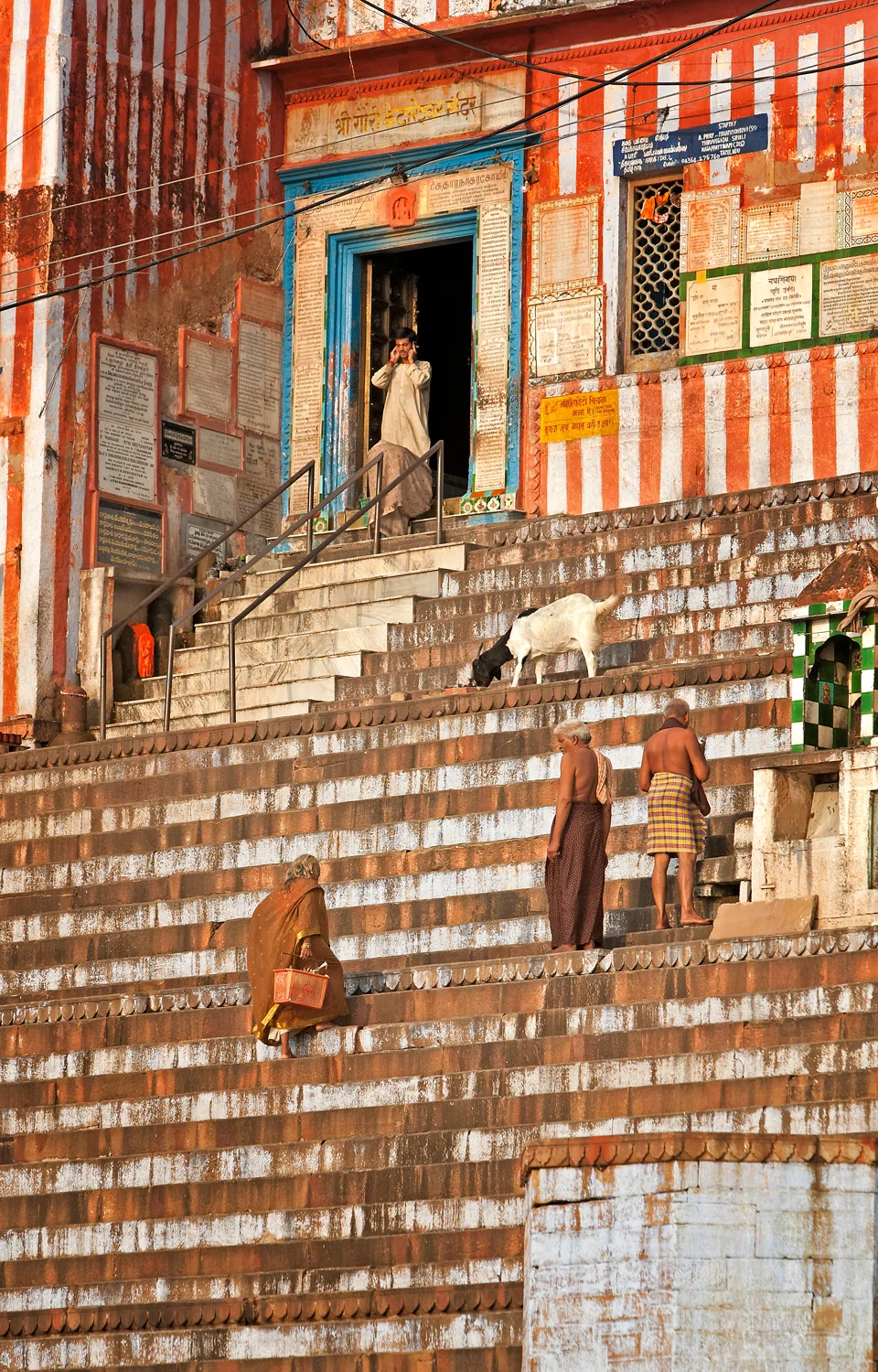 Climbing the steps to the temple, Varanasi, India