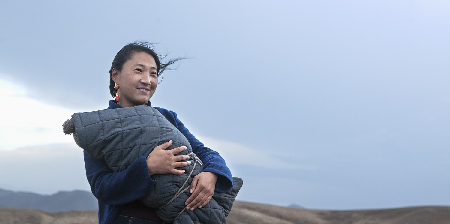  Mother swaddling child - for Norlha textiles in Amdo on the Tibetan Plateau 