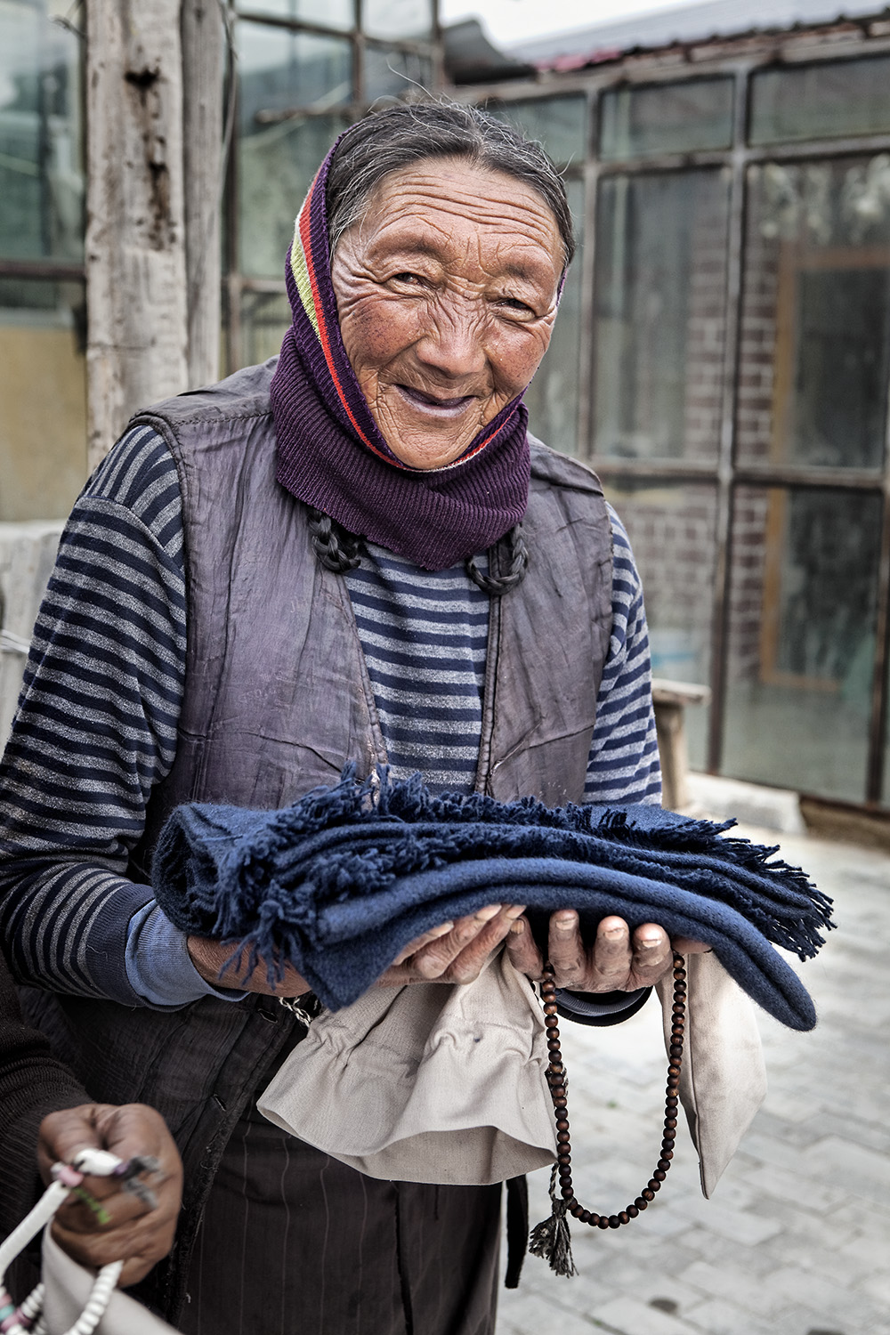  All over 80 year olds in the village of Ritoma, Amdo, Tibet, receive a new scarf for Sagadawa from Norlha Textiles. 