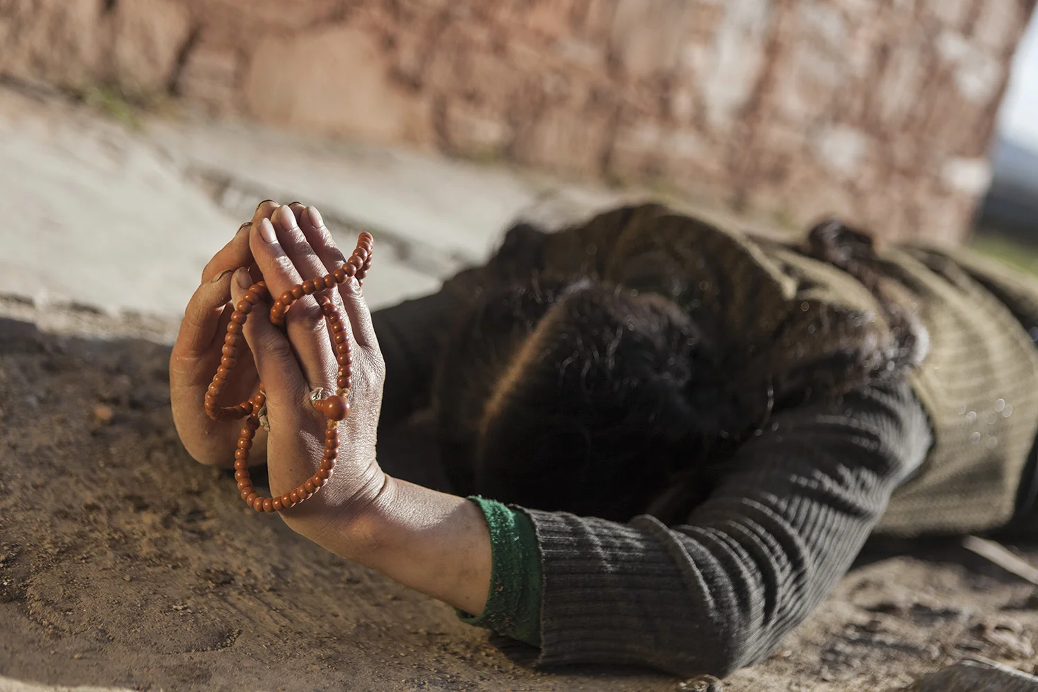 Woman circumambulating the monastery during Sagadawa - Ritoma, Amdo, Tibet - for Norlha Textiles