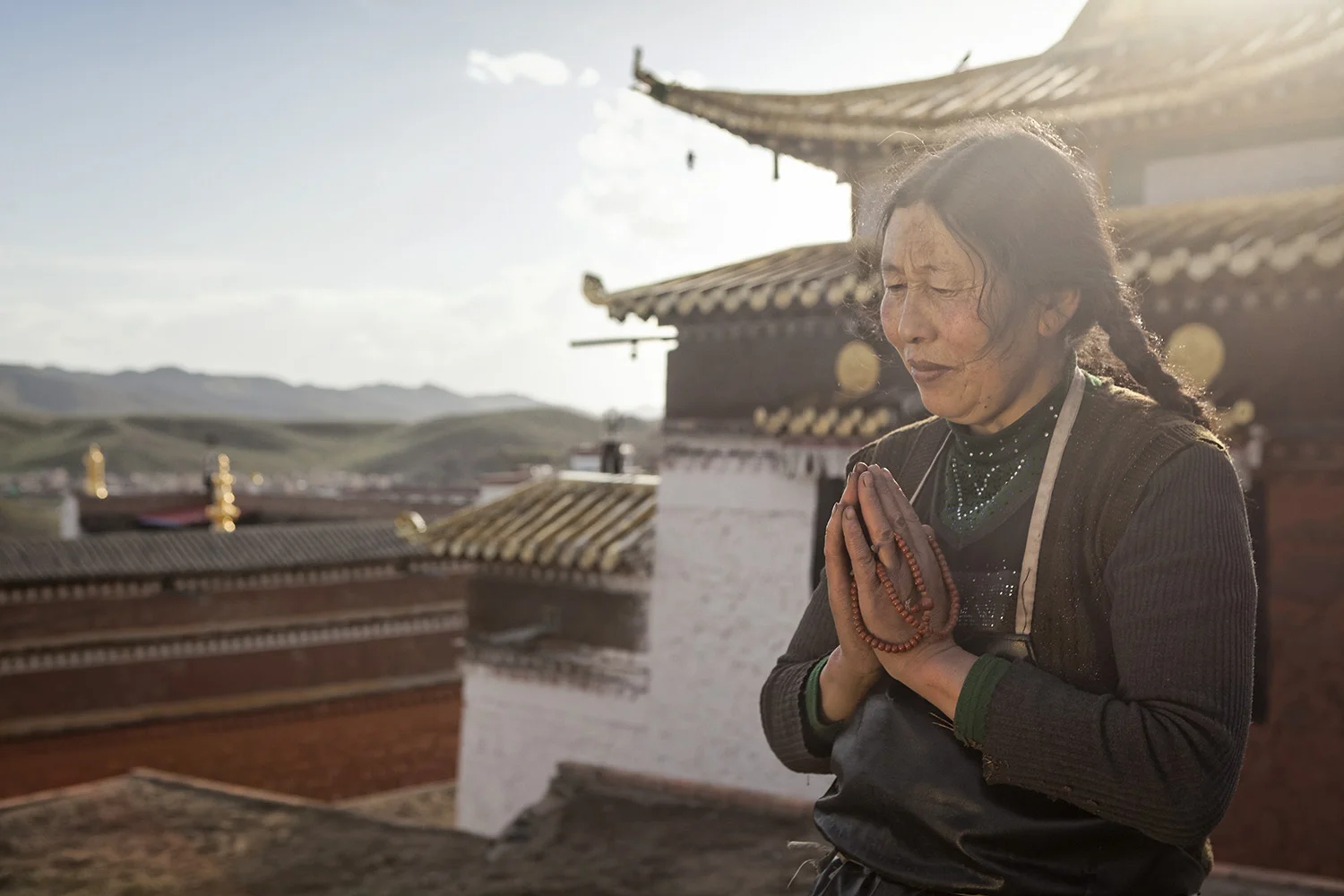 Woman circumambulating the monastery during Sagadawa - Ritoma, Amdo, Tibet - for Norlha Textiles