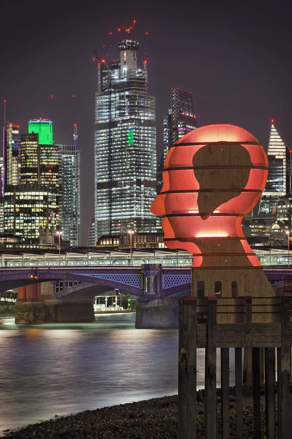 Light sculpture, "Head Above Water" by Steuart Padwick on the Oxo Tower pier, South Bank, London. Interactive lighting installation by Hoare Lea Lighting. The sculpture supports Time to Change's campaign to remove the stigma of mental illness.