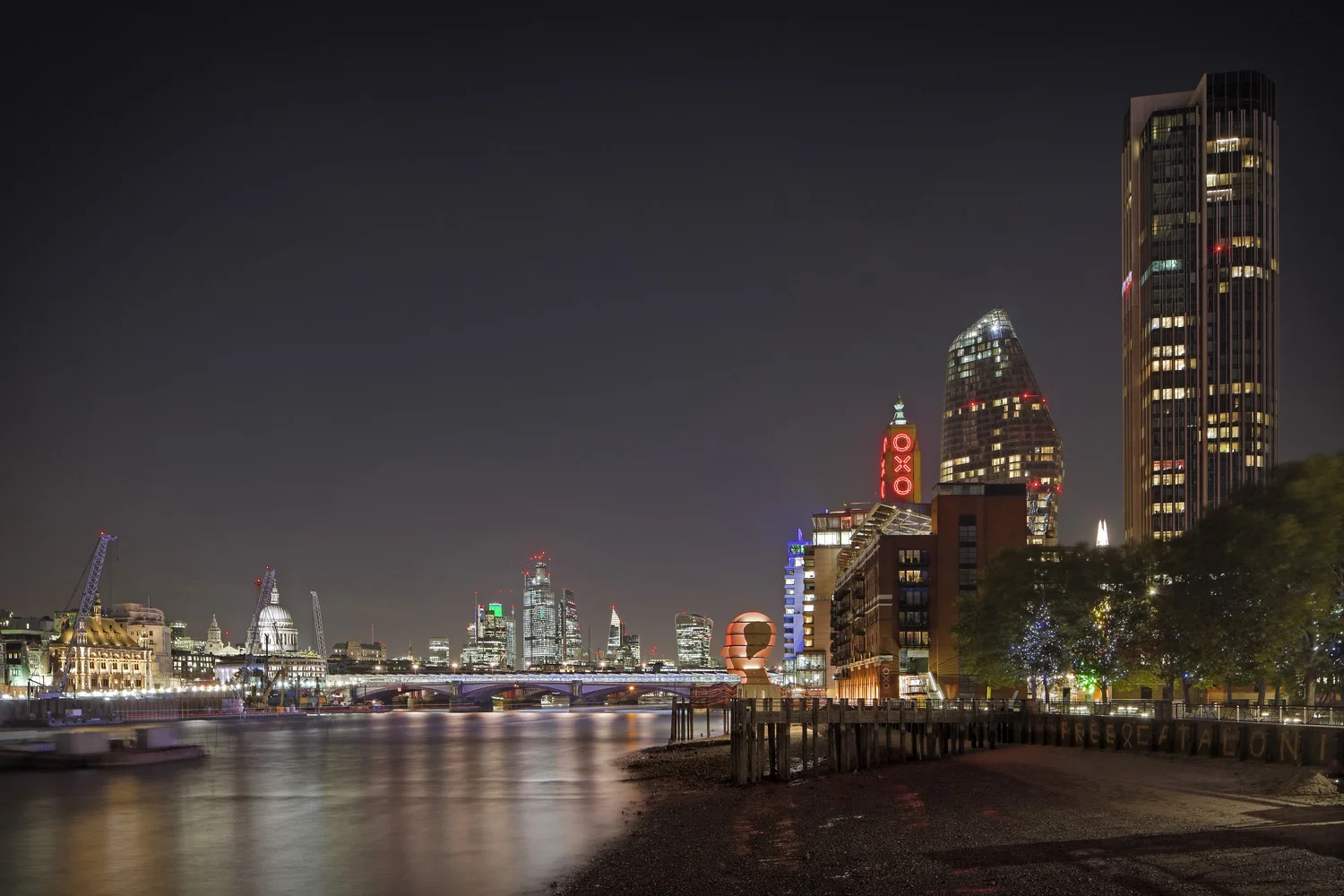 Light sculpture, "Head Above Water" by Steuart Padwick on the Oxo Tower pier, South Bank, London. Interactive lighting installation by Hoare Lea Lighting. The sculpture supports Time to Change's campaign to remove the stigma of mental illness.