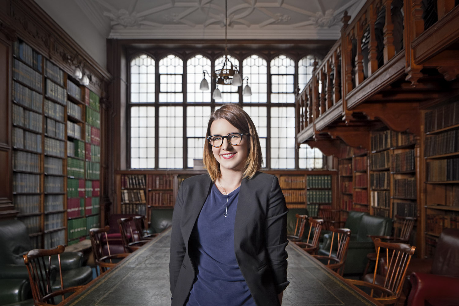  Portrait of journalist Claire Connelly in the Goodman Library at the University of Oxford Student Union, Oxford, UK 