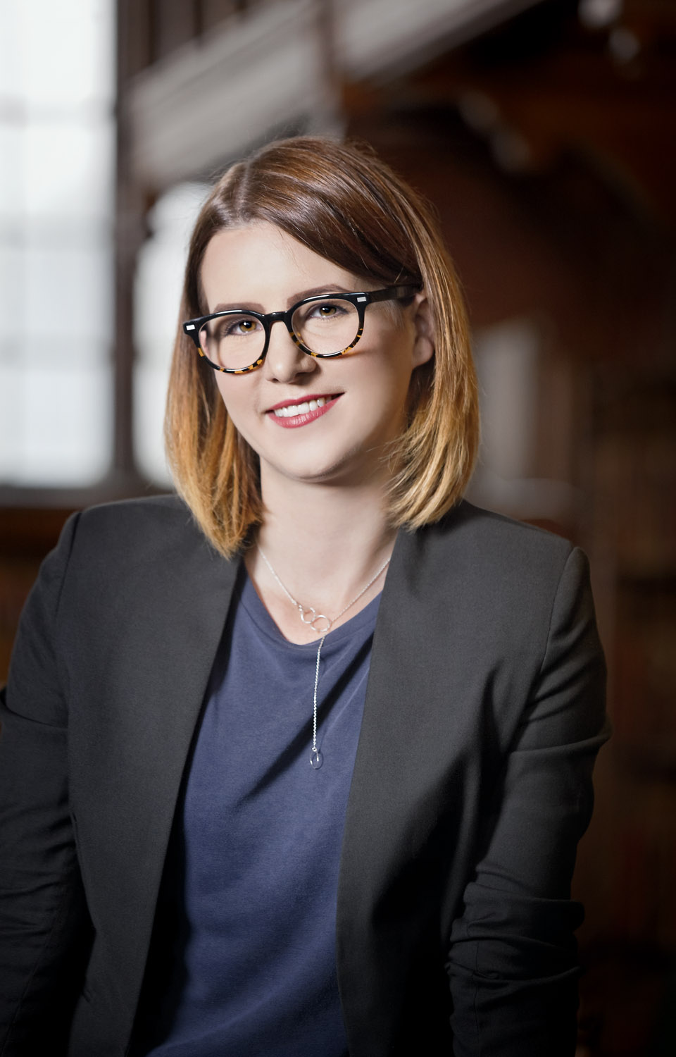  Portrait of journalist Claire Connelly in the Goodman Library at the University of Oxford Student Union, Oxford, UK 