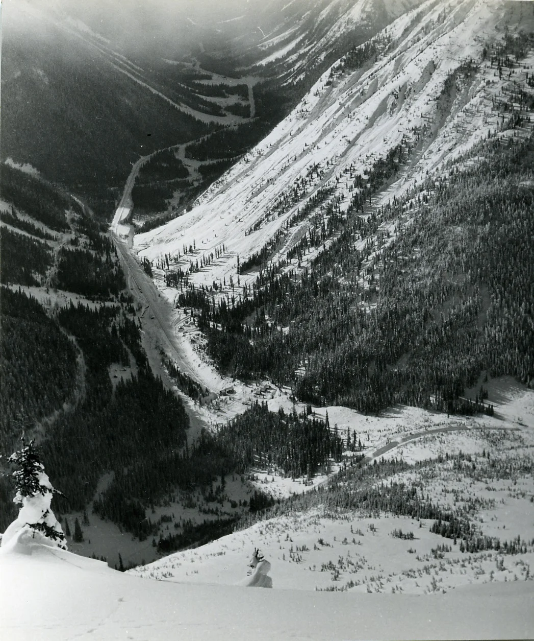 PSA.8 View from avalanche crest to Glacier with west portal of Connaught Tunnel. Feb. 1957