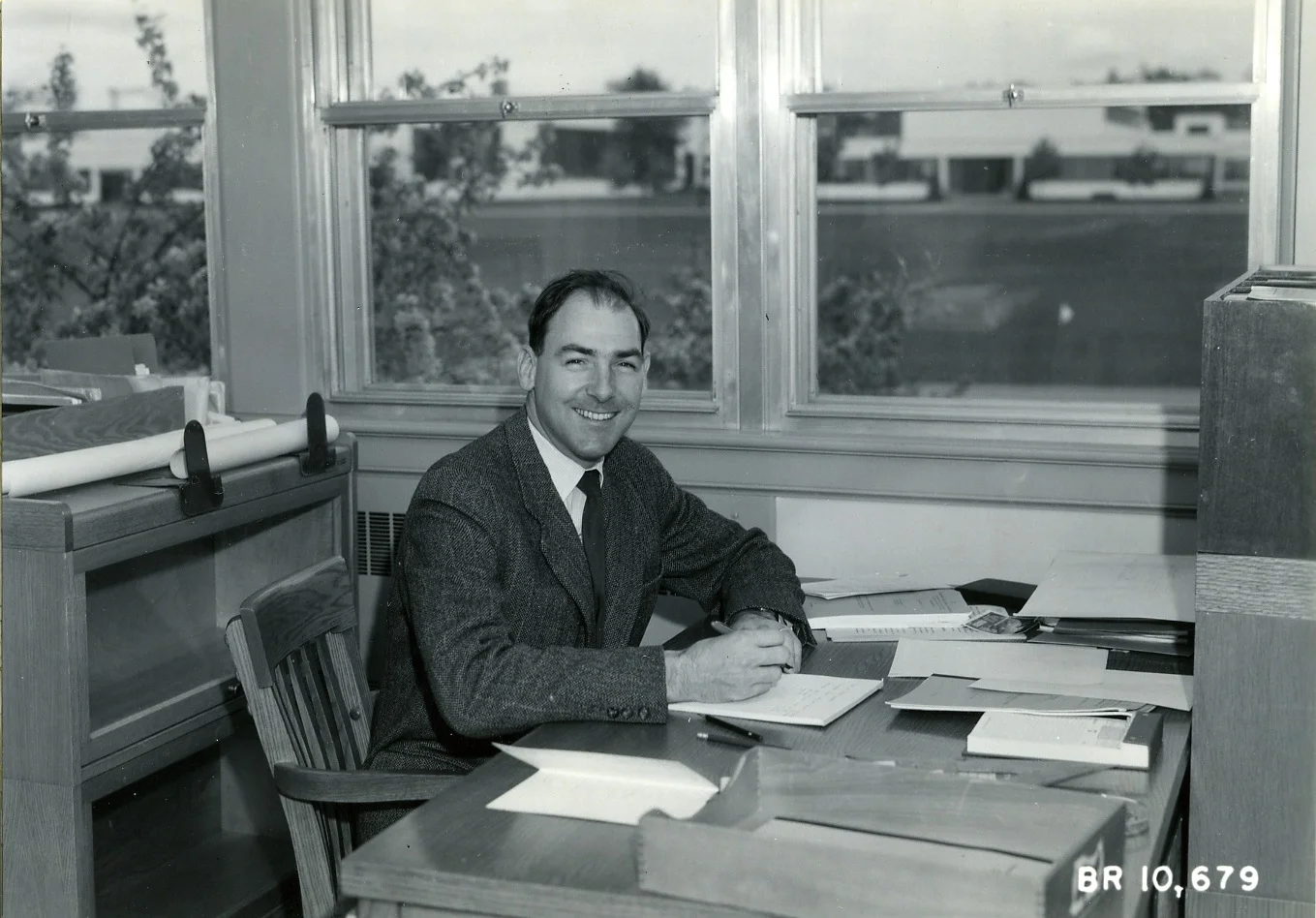 PSA.71 P. Schaerer at desk in office in Ottawa. Apr. 1961