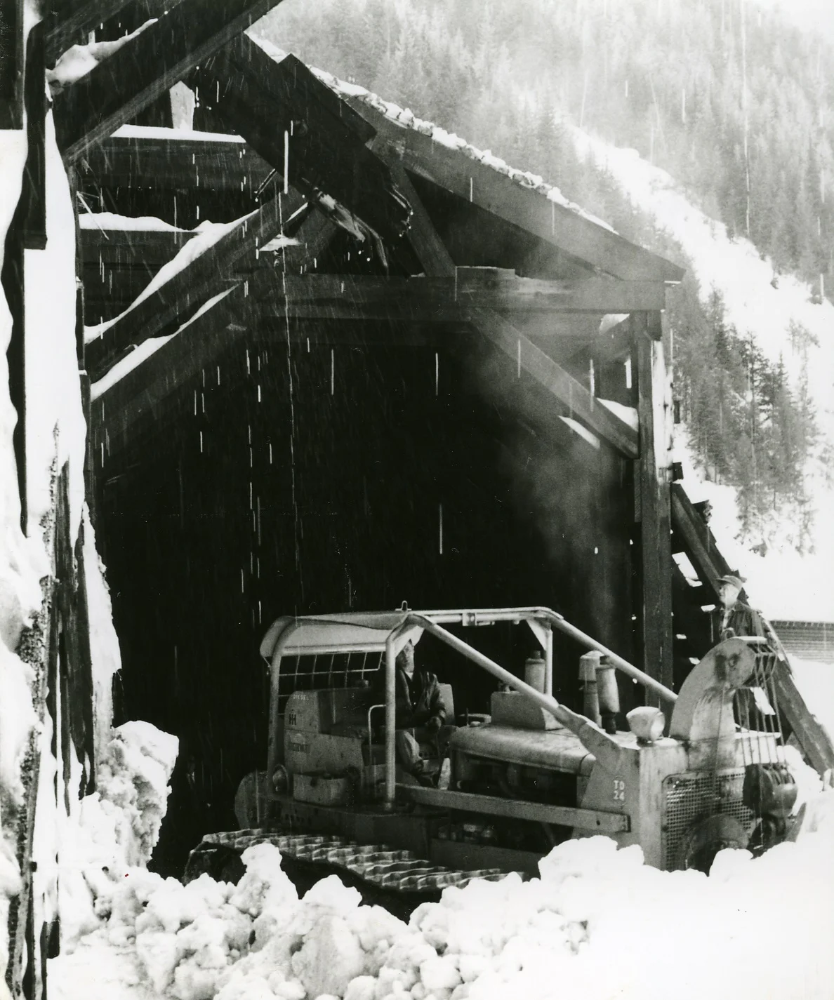 PSA.82Removal of avalanche snow in broken snowshed. Apr. 12, 1959