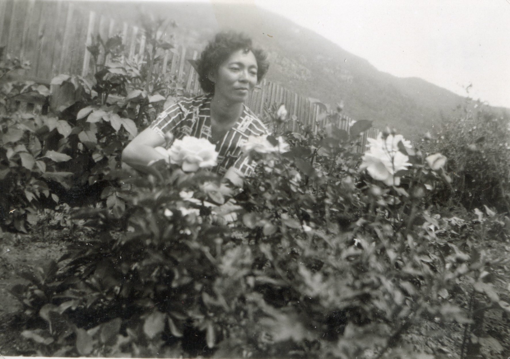 14283 Mary Okumura in her flower garden.jpg