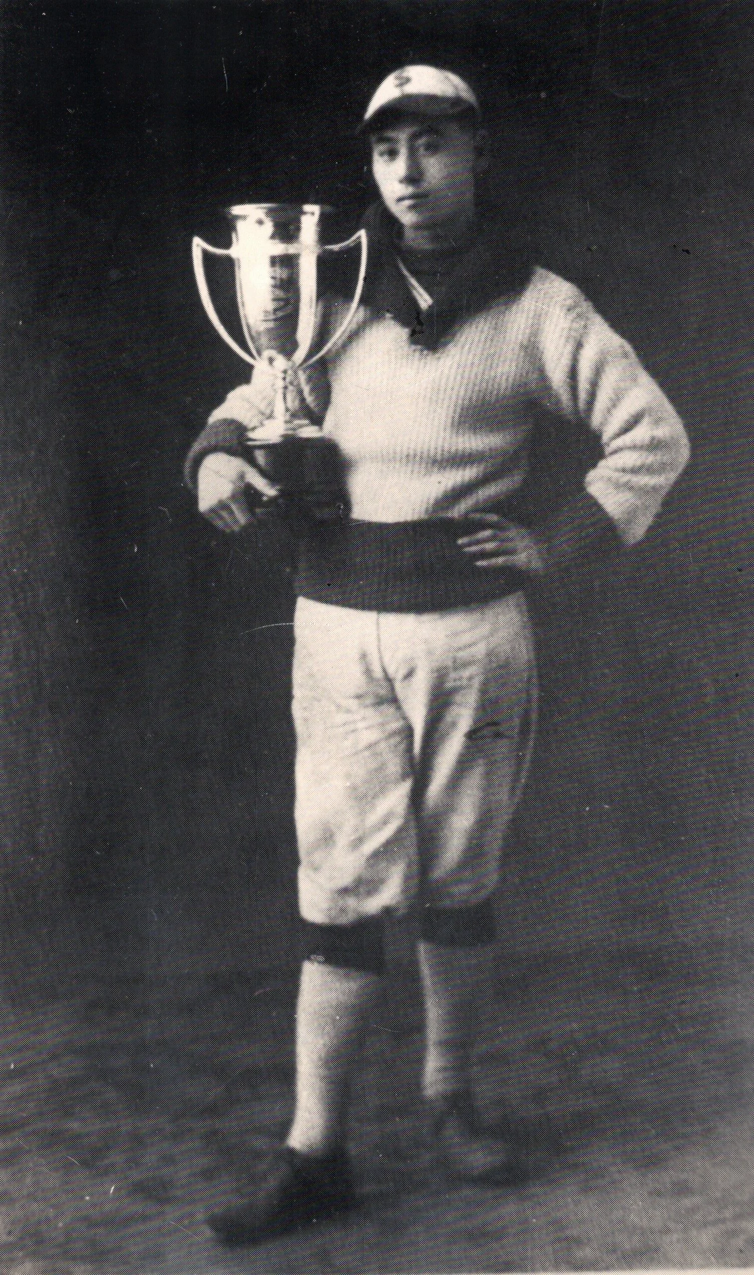 Dave Higano is holding a baseball pitching award trophy. P-14452.