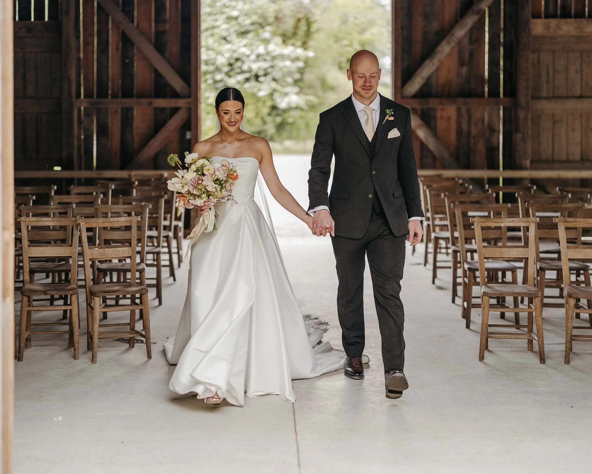Wedding couple in nancarrow farm barn  just married