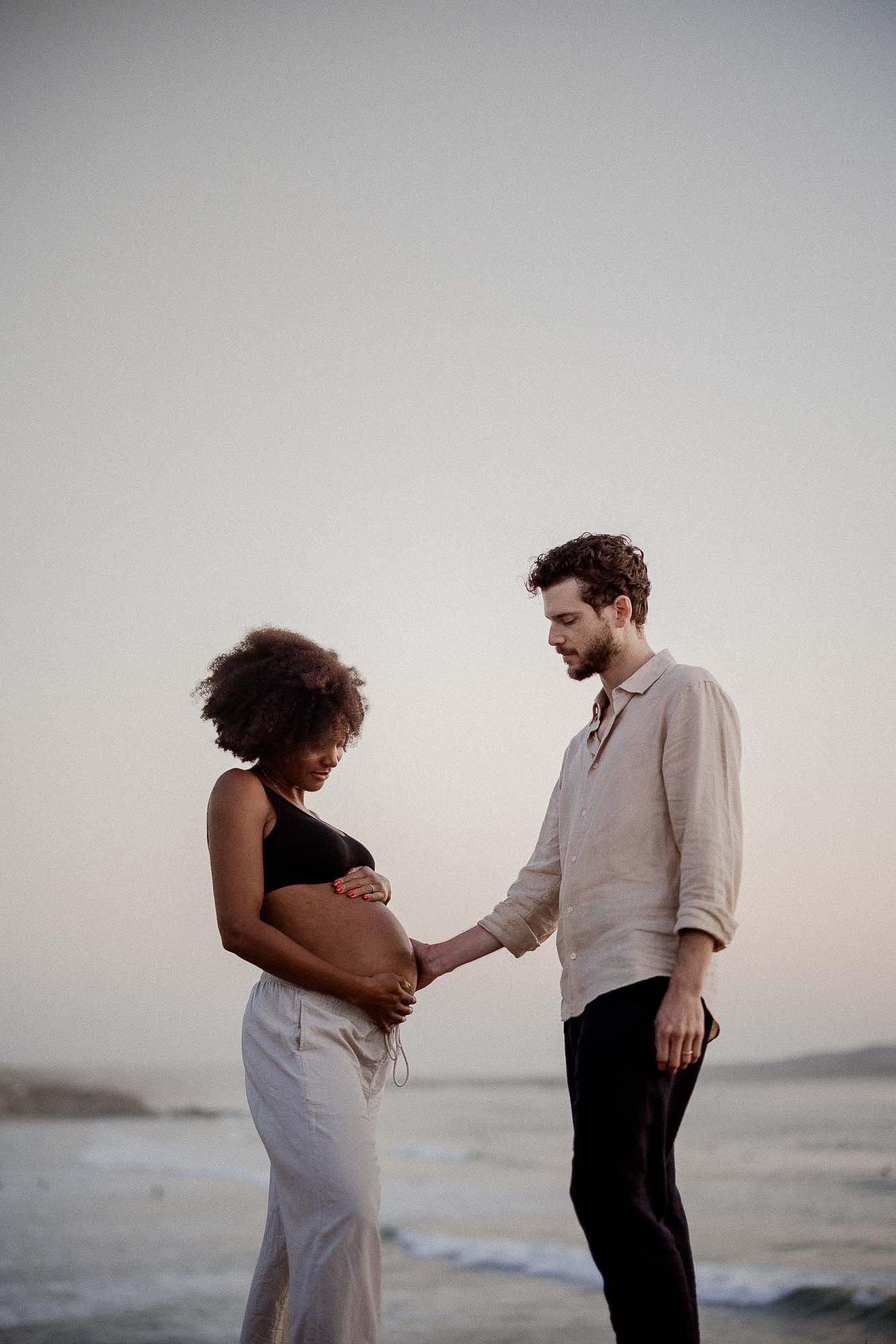 Couple with bump on beach