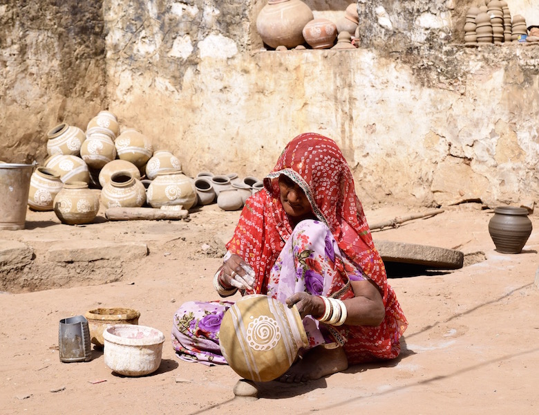 Indian woman painting pot.jpg