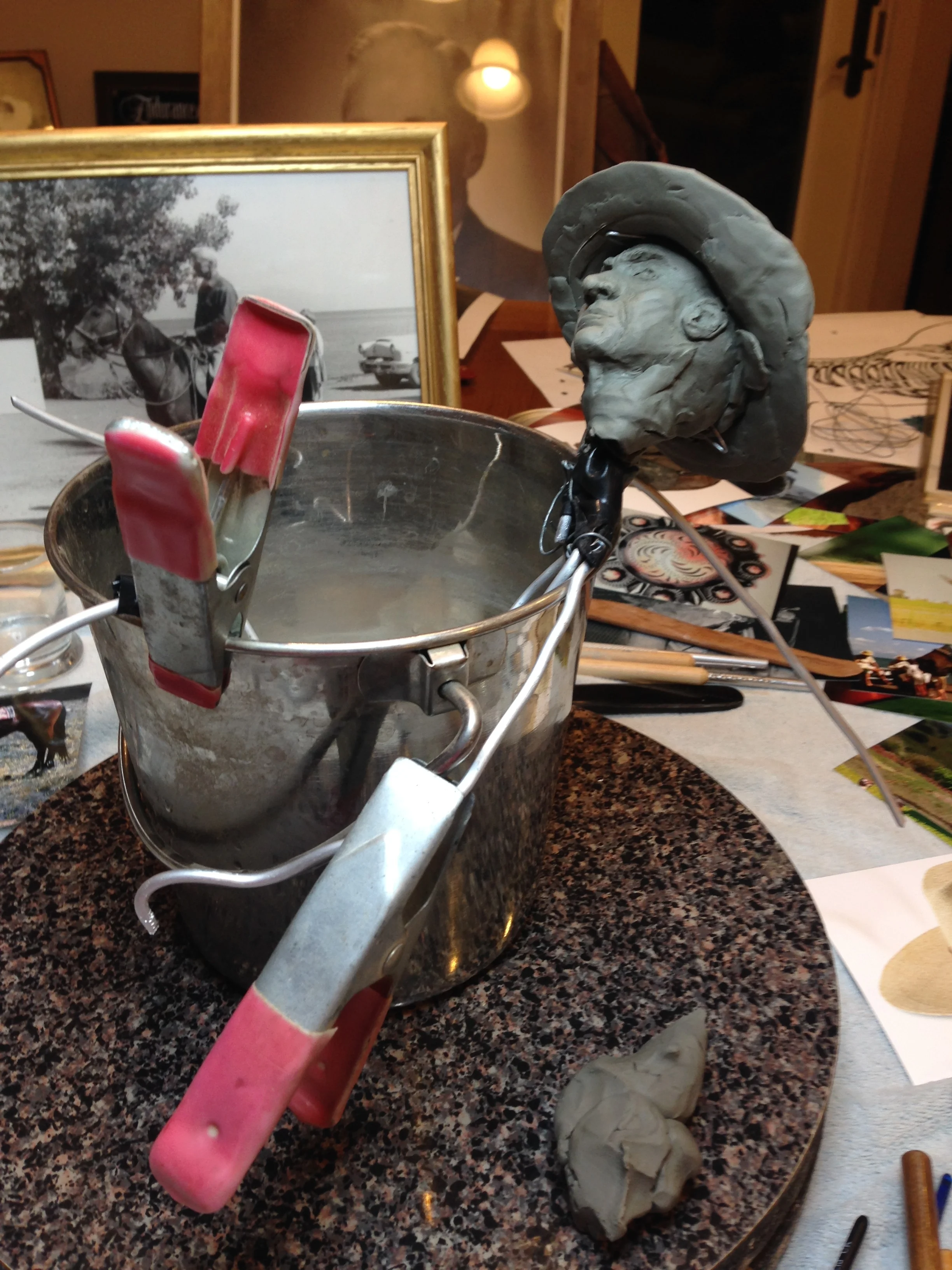 I used whatever worked to help hold Wendell. A dog show water bucket and shade clips.