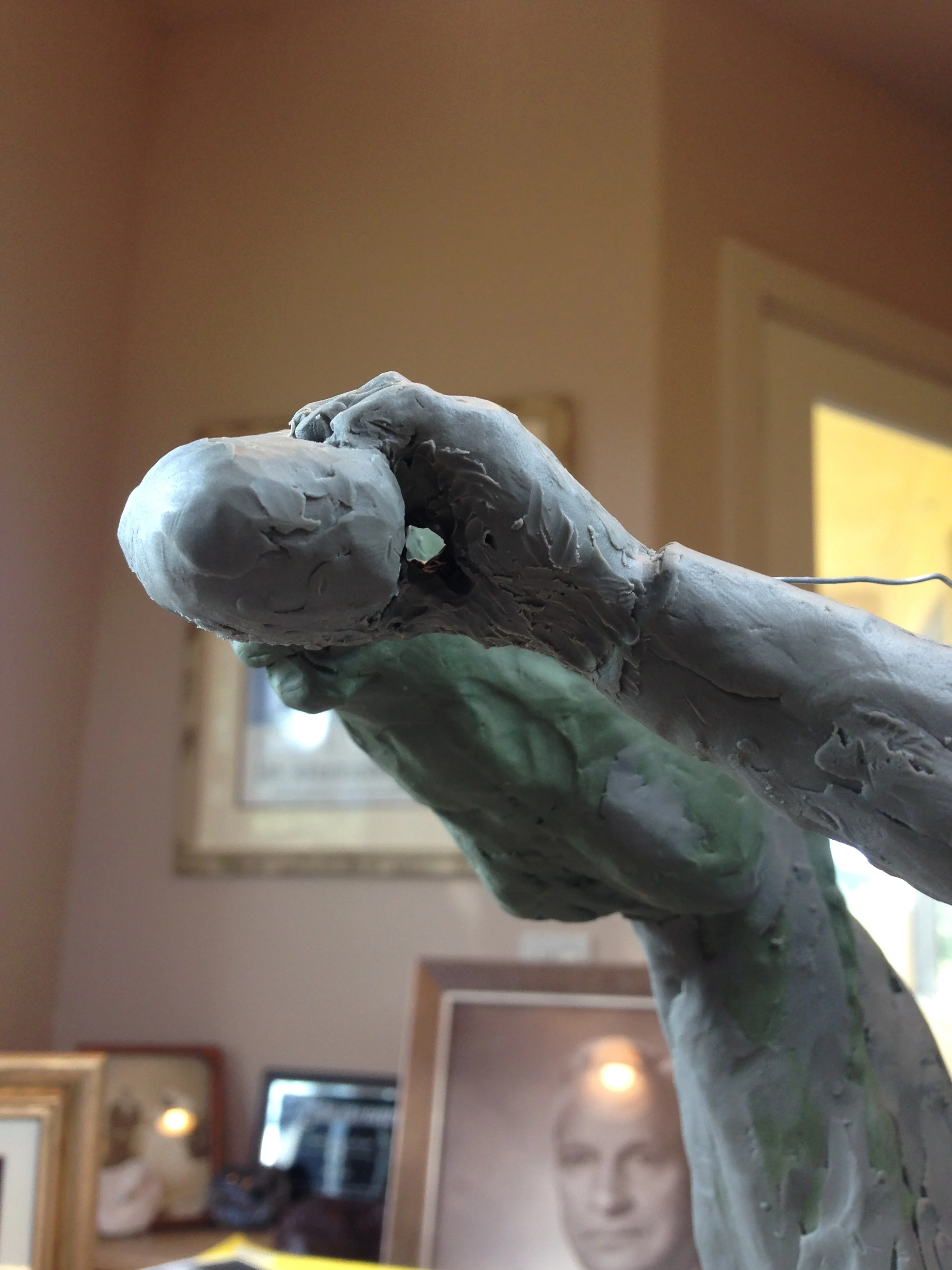 The start of the canteen, hand/arm and how it attached to the horse's teeth.