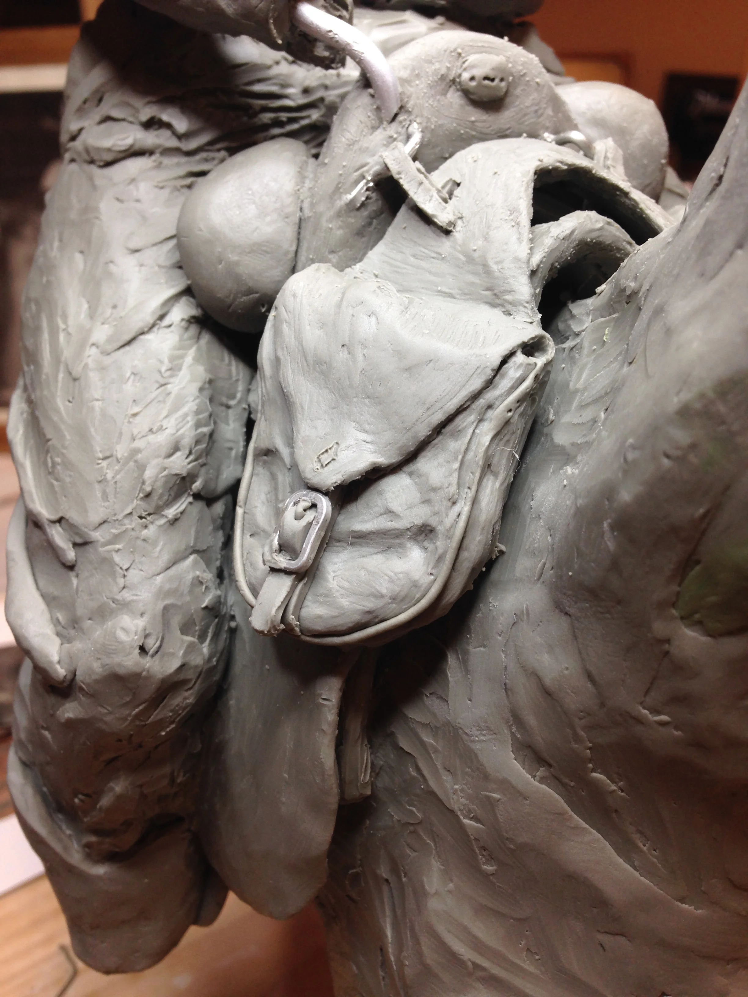 Working on the saddle bags or Wendell's right hand.
