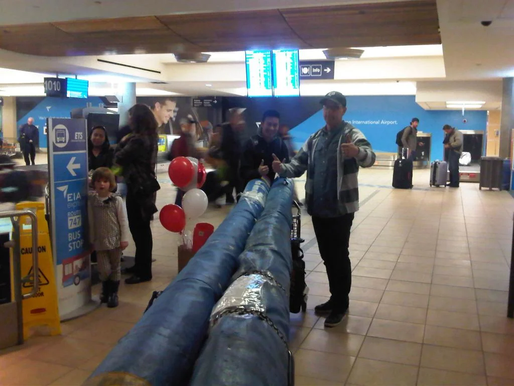 Andrew Choi and his coach, Cory, in the YEG airport after returning from Phoenix, AZ.