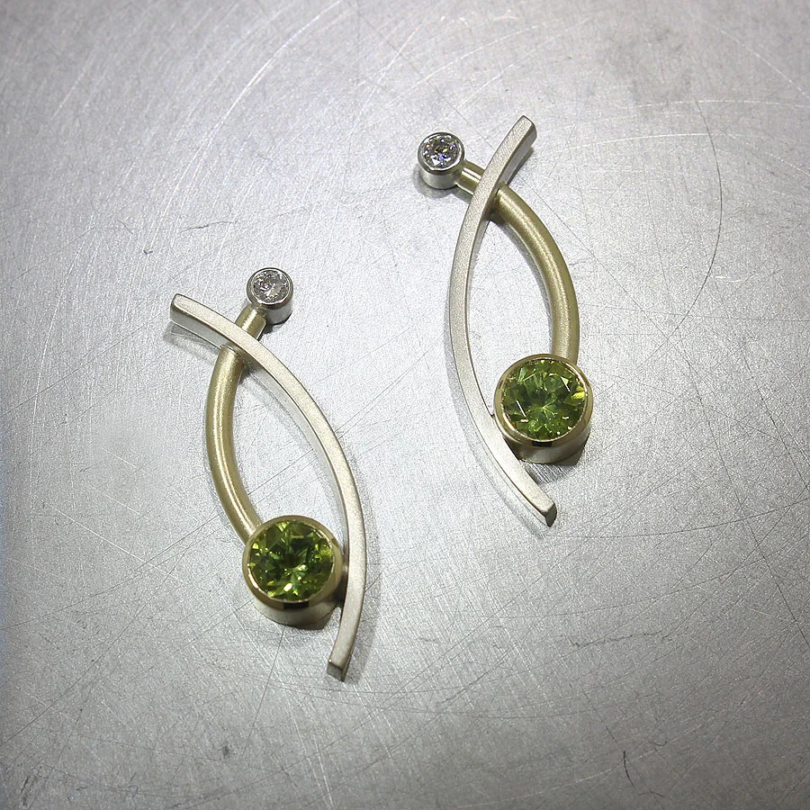 Item #23310924: Curved Sheet & Wire Earrings with Bezel-Set Peridots & Diamonds, 18kt Yellow & 14kt White Gold