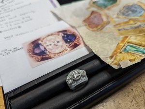 Inspo pics next to wax model of custom designed engagement ring