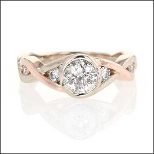 smooth low setting in rose and white gold infinity twist engagement ring