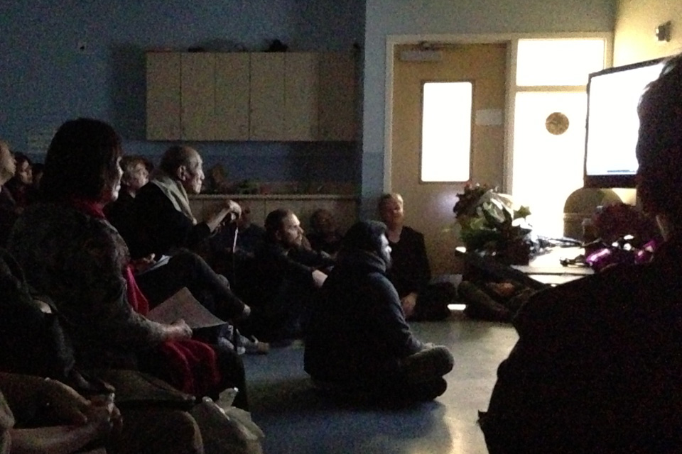  ​Khyongla Rato Rinpoche watching a video with students at The Tibet Center. April 22, 2013.&nbsp; Photo by Rob Hadley  
