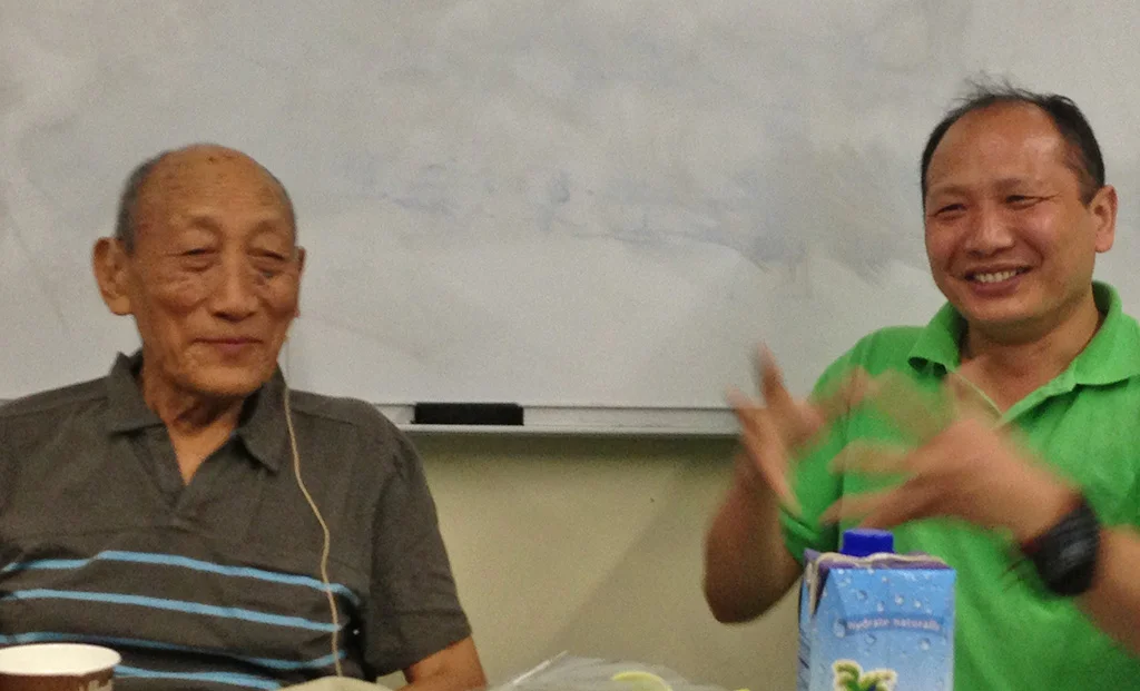 Khyongla Rato Rinpoche (left) teaching on Nagarjuna's Precious Garland, with Thupten Thokmey translating. July 8, 2013. Photo by Jane L. Wechsler