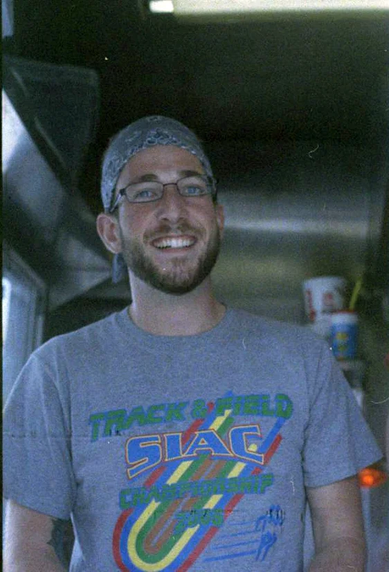 This guy served me a pretty okay mac-n-cheese grilled cheese sandwich. Olympus OM-G - Lomography CN-800