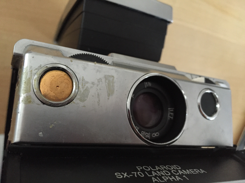You can see the residue from the scotch tape. The button's mechanism is resting in it's spot without a protective cover to keep it in place.