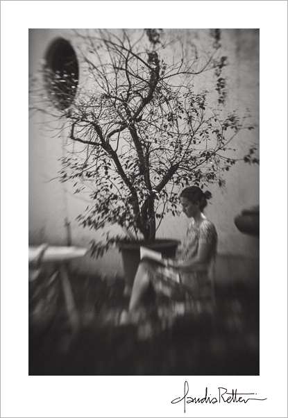 Woman reading under a tree