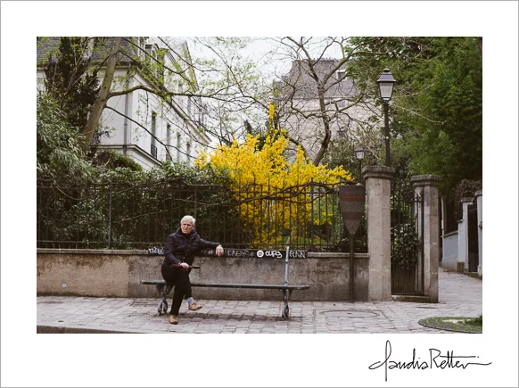 Man on bench with flowers