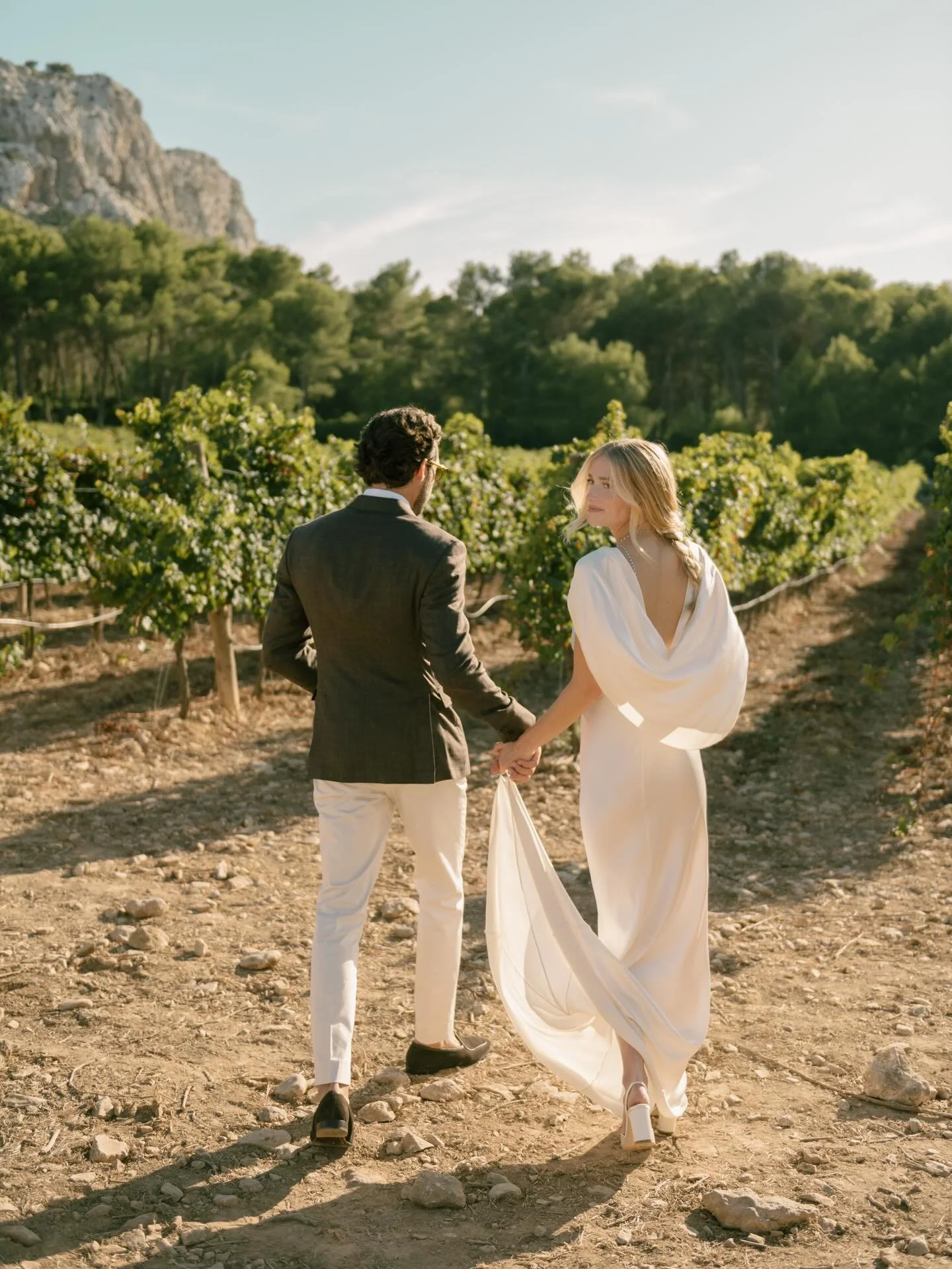 Tucked in the quiet vineyards of the Formentor region of Mallorca, J &amp; G&rsquo;s rehearsal dinner unfolded beside historic fincas, golden sunflowers, and that unmistakable Mallorcan light. Jenny wore a vintage silk Christian Dior by John Galliano