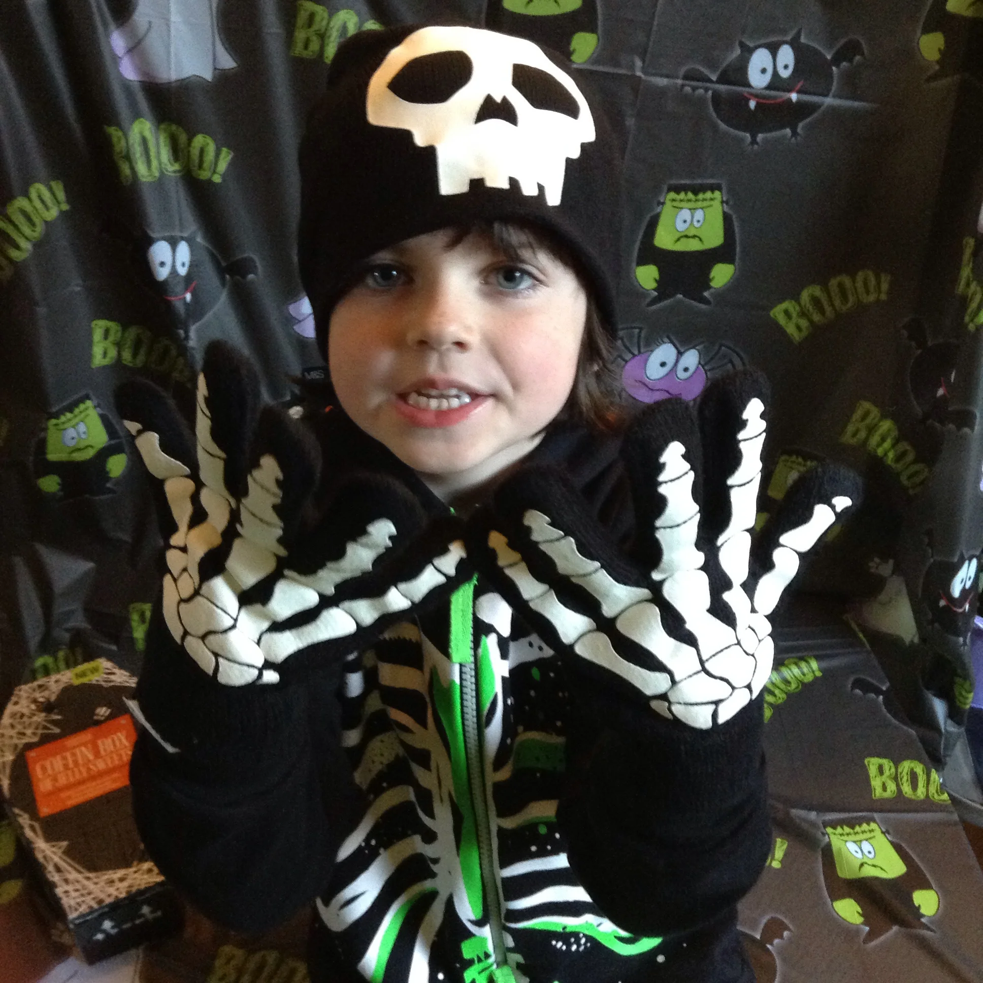 Skull hat and gloves £12 This is his 'hurry up and let me eat the sweets, mummy' face