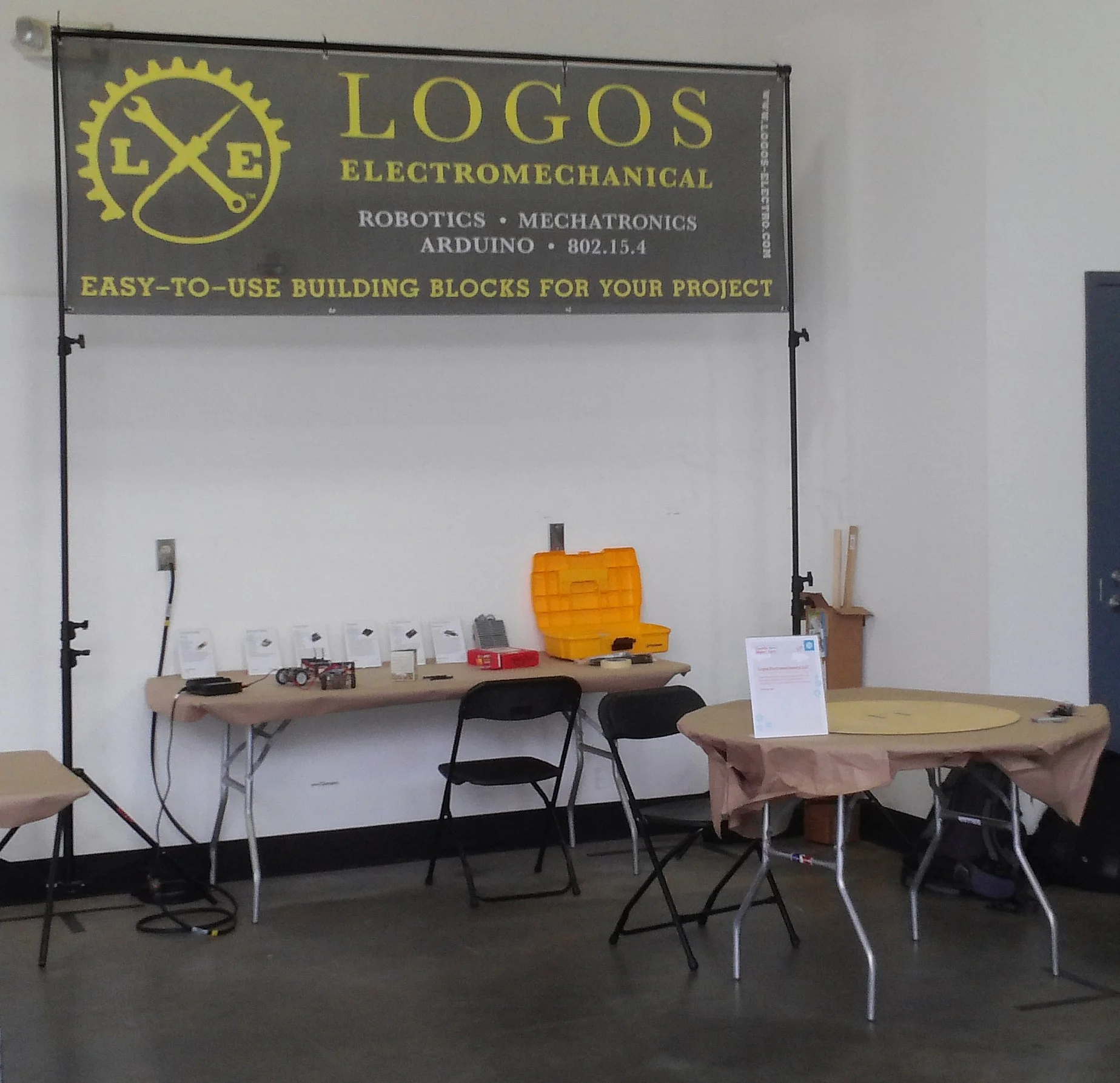 Our booth during setup. We got another table and a fence around the playing field on the right. 