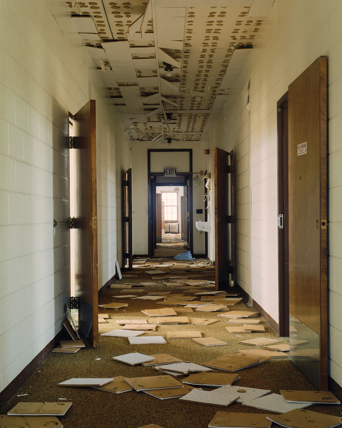 Hallway with fallen ceiling tiles, Cottage 4.