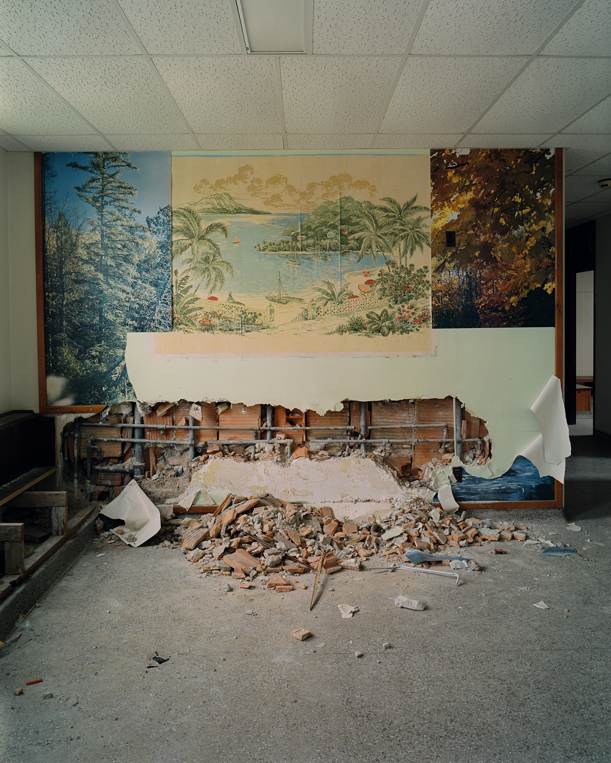 Peeled murals and debris in dayroom, Cottage 4.