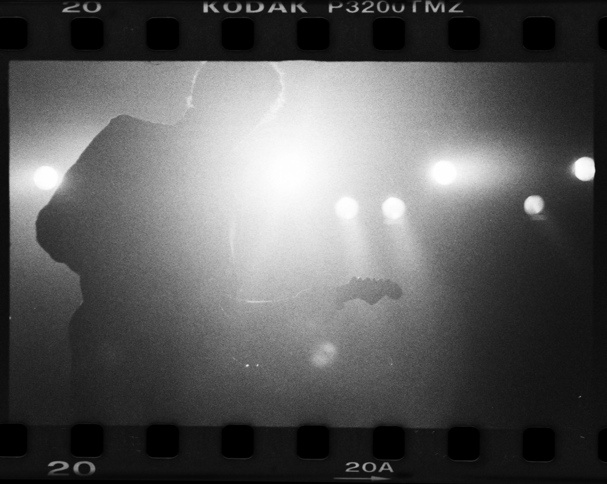 A shot of Wiping out Thousands on Tmax 3200iso film:
Last night at First Ave was the annual Best New Bands showcase. In addition to shooting digital as I normally do, I was also testing out the new Leica I just got using some high speed film (I hinted about this camera on Thursday, and will write more about it soon). A number of the shots were underexposed, but I just love the feel the grainy, high-iso film gives this backlit shot of Wiping out Thousands. I feel lucky to have seen many of the band performing before, but most were as in-studio sessions at The Current and not in front of a live audience. It was great to see these bands up on the main stage of First Ave and for many of the bands, it was likely the biggest crowd they've ever played for. In-studios are great intimate performances, but there is a totally different energy from the bands as they play for a 1000+ people. A gallery of digital shots from the show will be on http://TheCurrent.org/ on Monday. 