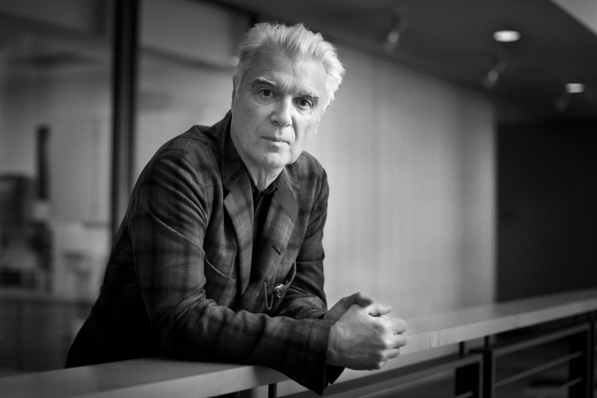 Yesterday at The Current, I was in the middle of a video edit when producer Jade knocked on my cubicle to tell me David Byrne was just finishing an interview with the Morning Show's Steve Seel, and asked was I free to take a quick portrait. I had about a total of 90 seconds to put a fresh memory card in my camera, find a good space in the building atrium, and double check my exposure before David Byrne was there and ready. I had about one minute to get both a portrait of David Byrne solo and with Peter Remes, owner and developer of the Aria art space where David Byrne is presenting his art/music installation "Play The Building." A quick shoot to say the least, but I'm quite happy with capture of David Byrne's intense artistic personality.