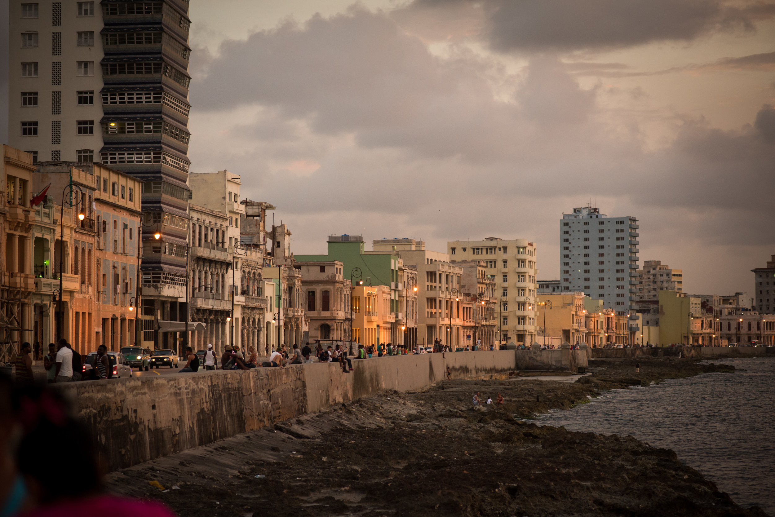 Dusk on the Malecon, the roadway and seawall along the bay that is a gathering place for Cubans and tourists alike